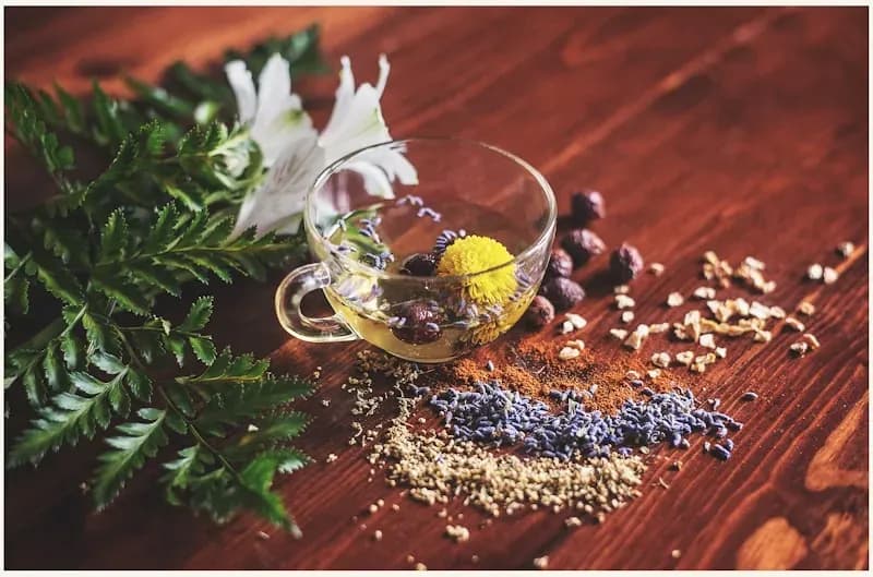 Whole-leaf tea steeping in a glass cup